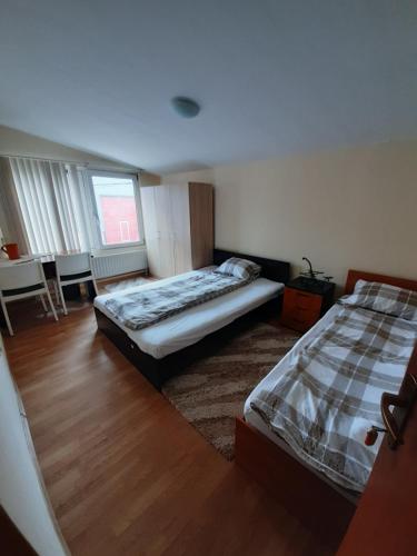 a bedroom with two beds and a window at SepcoServ in Apahida
