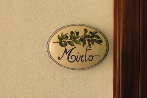 a plate on a wall with the word nordula at B&B Casa Gianfranca in Portoferraio
