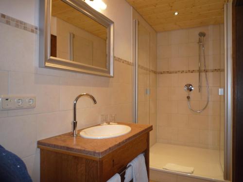a bathroom with a sink and a shower at Gästehaus Johanna in Bad Wiessee
