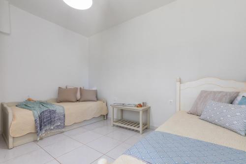 Ένα ή περισσότερα κρεβάτια σε δωμάτιο στο Ευδοκία