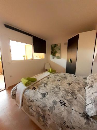 a bedroom with a large bed and a window at RESIDENCE NUEVO HORIZONTE in Costa de Antigua