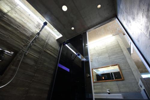 a bathroom with a shower and a sink at Penlai Home in Fengli