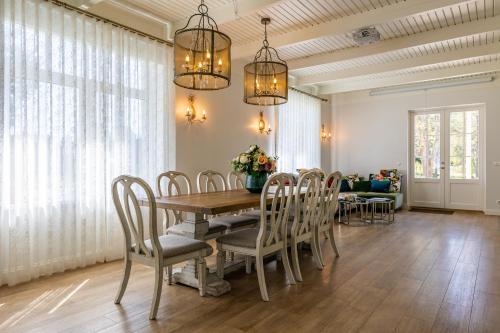 a dining room with a table and chairs at Tiismani Villa in Kärdla