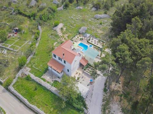 an aerial view of a house with a pool at Holiday Home Ela in Dračevica