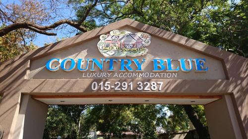 a sign for a county blue library accommodation at Country Blue Luxury Guest House in Polokwane
