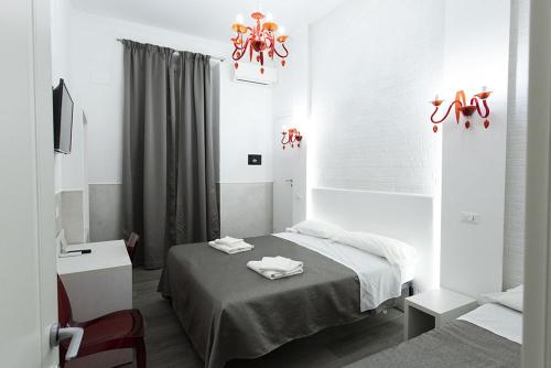 Postel nebo postele na pokoji v ubytování Rubino Guest House