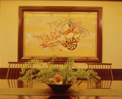 a painting of a horse pulling a cart on a table at Kamogawakan in Kyoto