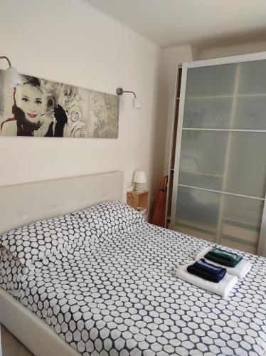 a bedroom with a bed and a mirror at Romantic getaway in the heart of Amalfi in Amalfi