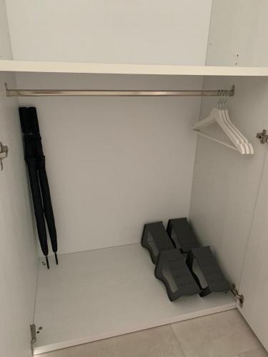 a walk in closet with black and white walls at Il Nido di Priscilla in Chiavari