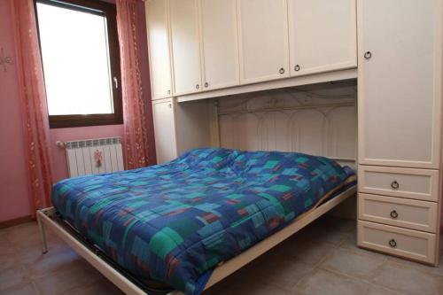 Tempat tidur dalam kamar di Casa Mirella - Toscolano Maderno