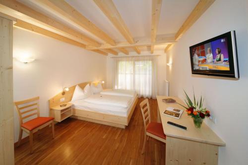 Giường trong phòng chung tại Gasthof Falger