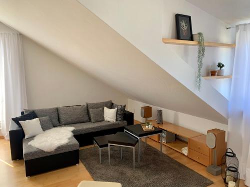 a living room with a couch and a table at MEINE OASE Ferienwohnung !!! NICHT FÜR MONTEURE !!! in Horn-Bad Meinberg