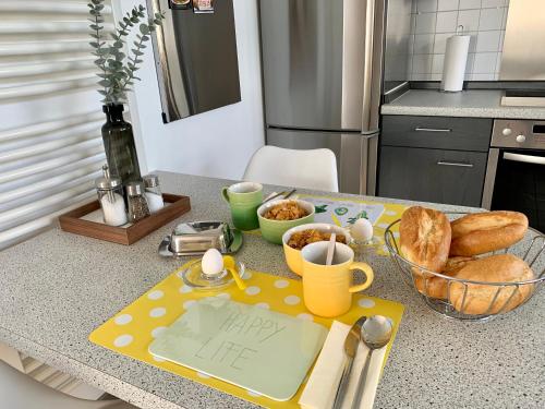 a kitchen with a table with a happy life sign on it at MEINE OASE Ferienwohnung !!! NICHT FÜR MONTEURE !!! in Horn-Bad Meinberg