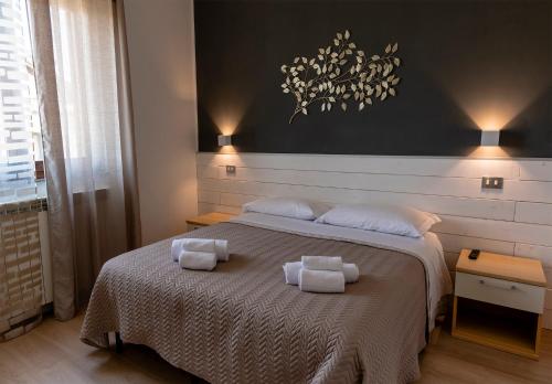 A bed or beds in a room at New Inn Residence