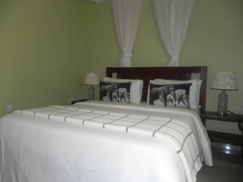 Postel nebo postele na pokoji v ubytování MAMIKKI Hotel Apartments