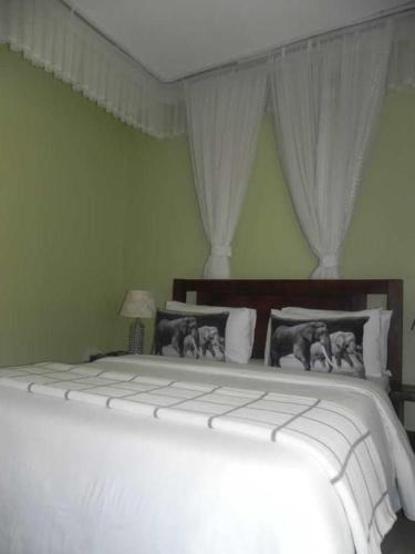 Postel nebo postele na pokoji v ubytování MAMIKKI Hotel Apartments