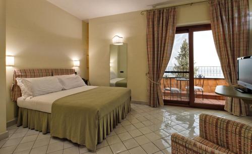 Llit o llits en una habitació de Hotel Villa Poseidon & Events
