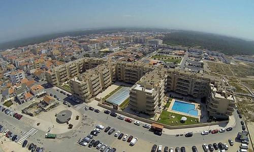 an aerial view of a building with a parking lot at Furadouro Beach Spot in Ovar
