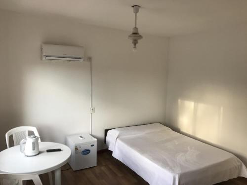 Giường trong phòng chung tại Departamentos LT1