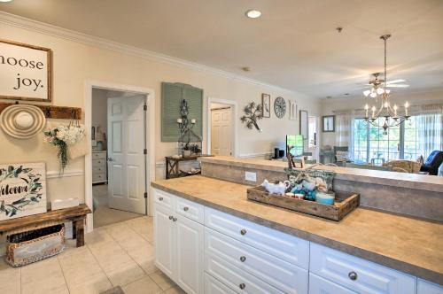 a kitchen with a large counter top in a room at Little River Condo with Pool Less Than 6 Mi to Beach! in Little River