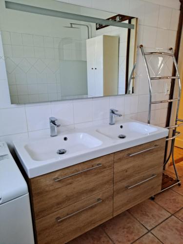 a bathroom with a sink and a mirror at bastide St Joseph in Eyguières