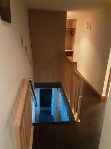 a swimming pool in the middle of a room at ’t Wielerpension in Steenhuize-Wijnhuize