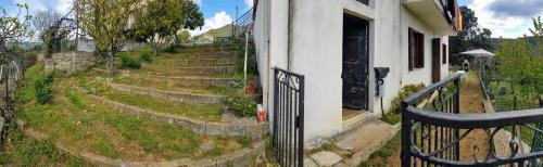 a gate in front of a house with stairs at Grande Maison de vacances in Santa-Maria-Siché