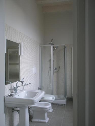 a bathroom with a sink and a toilet and a shower at Villa Marietta in Civitanova Marche