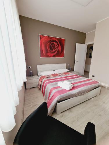 A bed or beds in a room at La Casa di Fiore