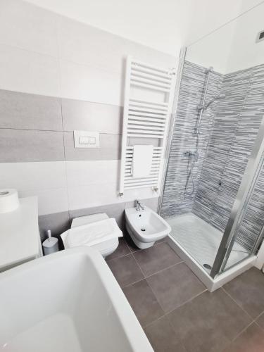 a bathroom with a shower and a toilet and a sink at La Casa di Fiore in Avezzano