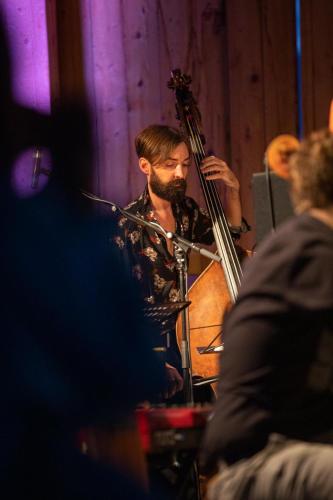 a man with a beard playing a cello at Ansitz Velseck-Residence Hotel in Tires