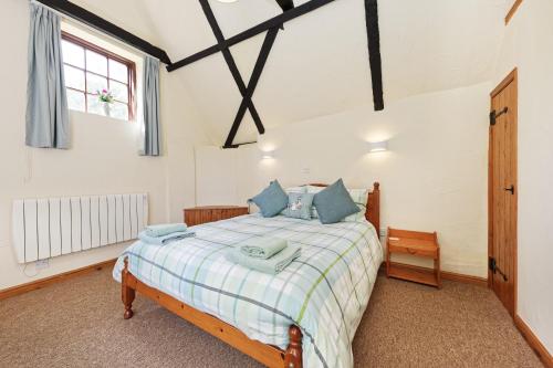 a bedroom with a bed and a window at Beachborough Park in Folkestone