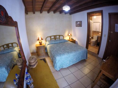 Katil atau katil-katil dalam bilik di Hotel-Boutique La Casa De Los Recuerdos