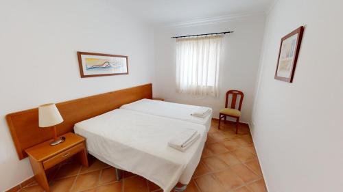 Ένα ή περισσότερα κρεβάτια σε δωμάτιο στο Monte dos Avós Village - Pet Friendly