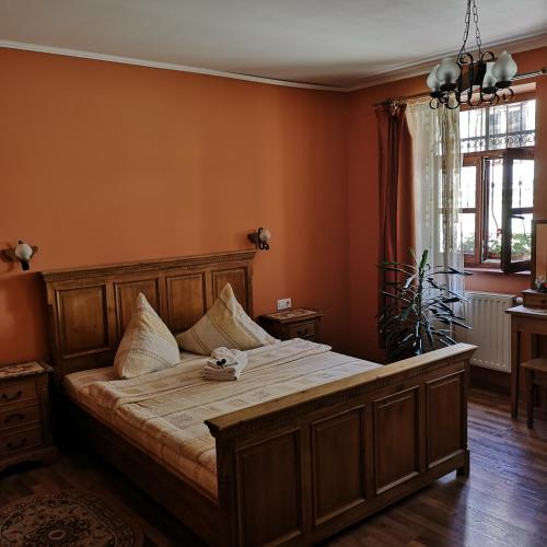 a bedroom with a large bed in a room at Casa Lia in Sighişoara