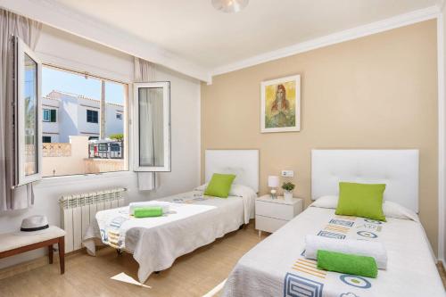 En eller flere senge i et værelse på Villa Yolanda - Cala'n Porter