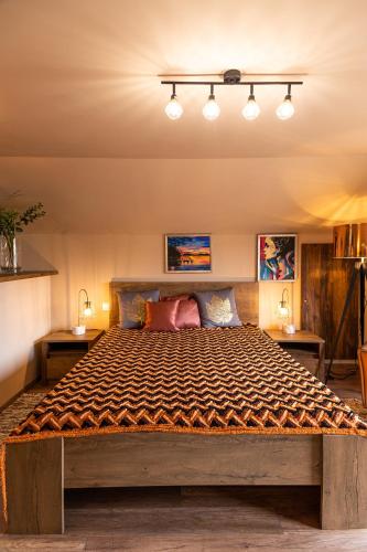 a bedroom with a large bed in a room at PelsoArt Apartments in Keszthely