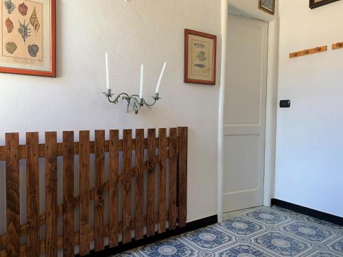 a hallway with a wooden fence and a door at Appartamenti Sentiero n1 in Levanto