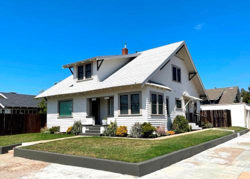 a white house with a gray roof at Fern House South Park Craftsman in San Diego