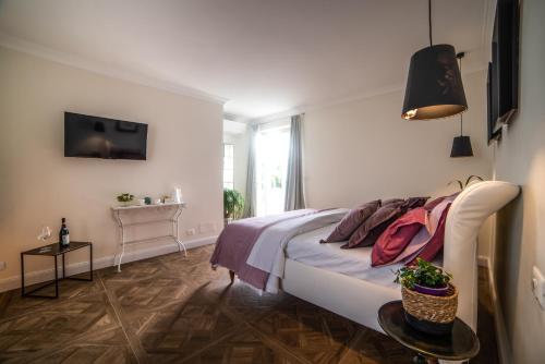 Postel nebo postele na pokoji v ubytování Borgo Piani - Camere di Charme