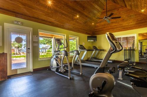 a gym with three exercise bikes in a room at Manchebo Beach Resort and Spa in Palm-Eagle Beach