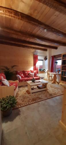 a living room with a couch and a table at B&B SognoInCadore in Domegge di Cadore