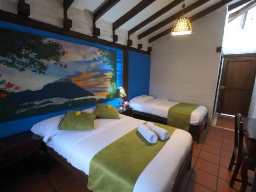 Una cama o camas en una habitación de Hostal Inti Luna