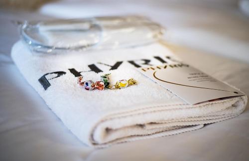 a book with two rings on top of a napkin at Beauty-Spa Apartment in Děčín
