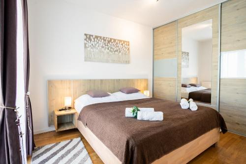 Posteľ alebo postele v izbe v ubytovaní Apartman Aqua
