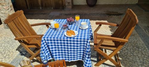 an overhead view of a table with a blue and white checkered table cloth at Catavento in Porto Santo