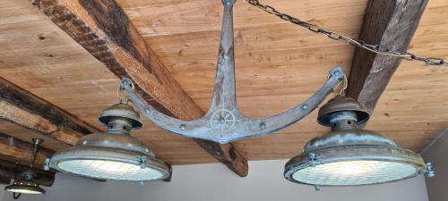 a pair of lights hanging from a ceiling at Catavento in Porto Santo