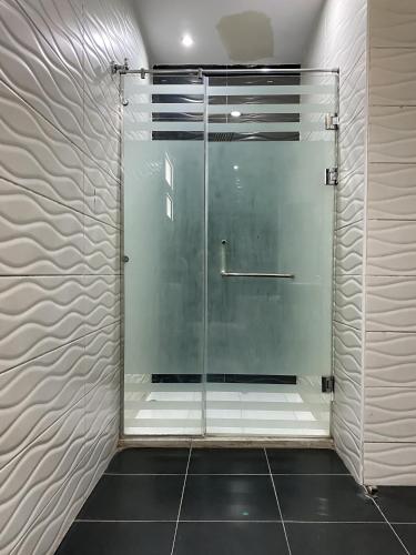 a shower with a glass door in a bathroom at Best View Pyramids Hotel in Cairo