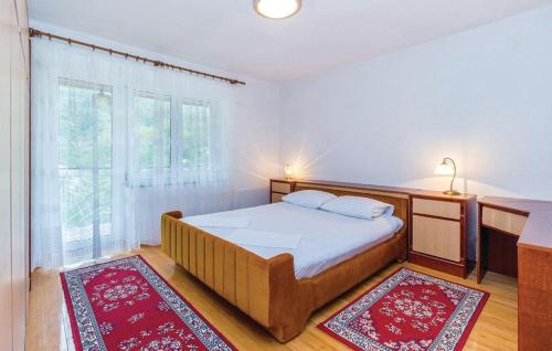 Postel nebo postele na pokoji v ubytování Apartments Vukelic