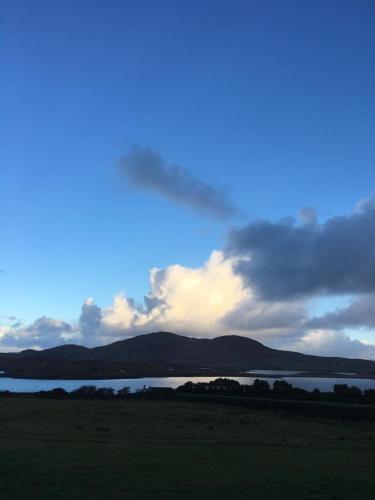 a view of a body of water with a cloudy sky at The Old Cable Historic House & Seafood Restaurant in Waterville